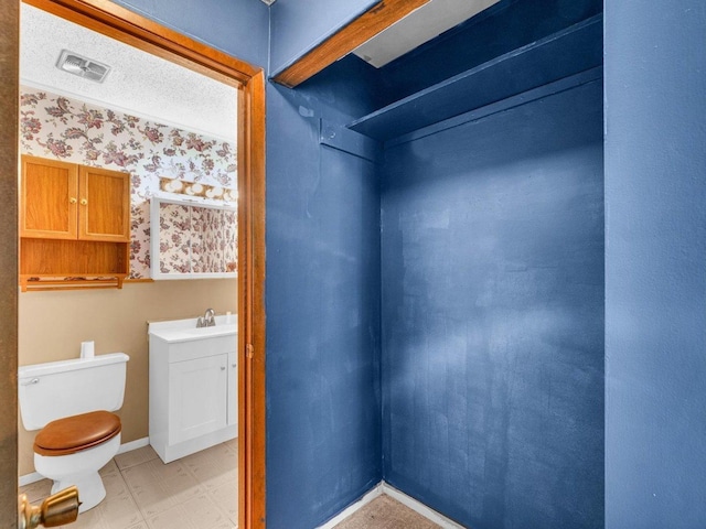 1045 Briarcliff Dr, Rantoul, IL 61866 - bathroom featuring toilet, tile patterned floors, vanity, and baseboards