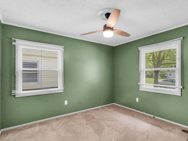 1045 Briarcliff Dr, Rantoul, IL 61866 - carpeted empty room with ornamental molding, a textured ceiling, a ceiling fan, and baseboards