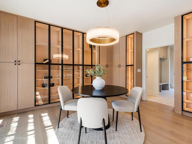 dining space with light wood-style floors