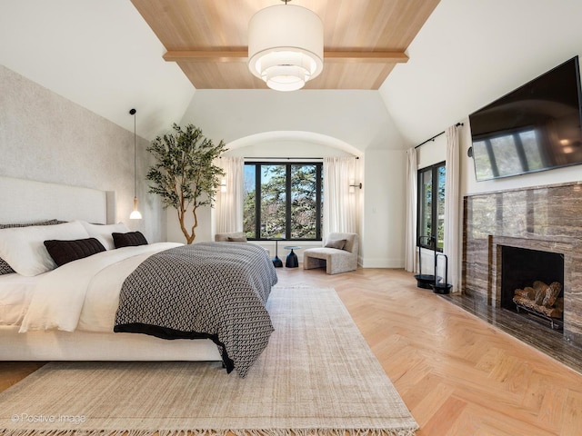 bedroom with high vaulted ceiling, baseboards, beamed ceiling, and a fireplace