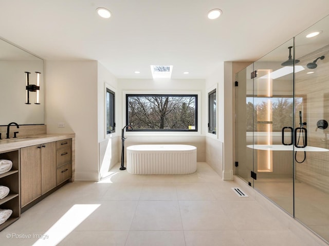 bathroom featuring a shower stall, visible vents, vanity, and a soaking tub