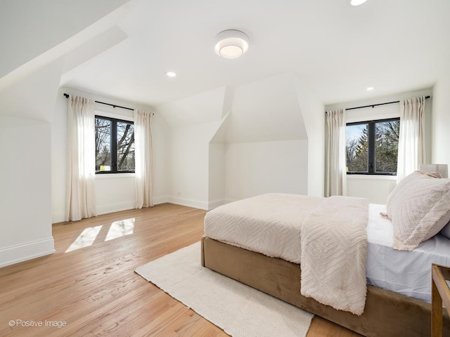 bedroom featuring recessed lighting, baseboards, and light wood-style flooring