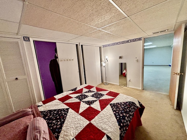 2445 Graham Rd, Belvidere, IL 61008 - carpeted bedroom with visible vents, a paneled ceiling, and a closet