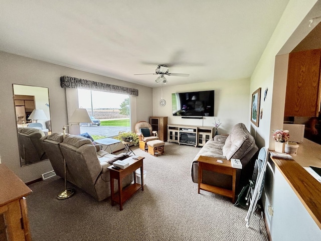2445 Graham Rd, Belvidere, IL 61008 - carpeted living area featuring visible vents and ceiling fan