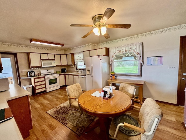 2445 Graham Rd, Belvidere, IL 61008 - dining space with light wood-style flooring and a ceiling fan