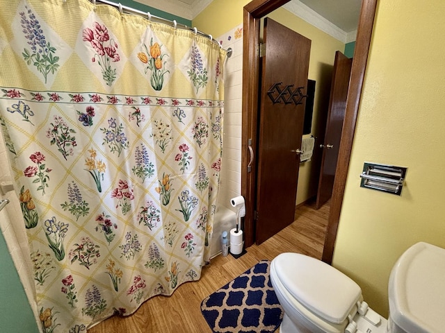 2445 Graham Rd, Belvidere, IL 61008 - full bathroom with wood finished floors, curtained shower, ornamental molding, and toilet