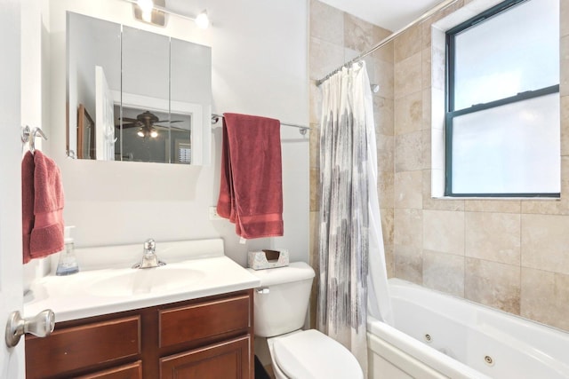 full bath with a combined bath / shower with jetted tub, toilet, and vanity