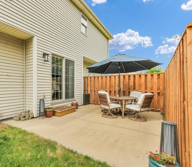 view of patio / terrace with outdoor dining area and fence