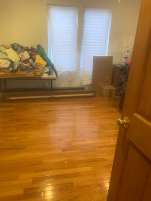 bedroom with light wood finished floors