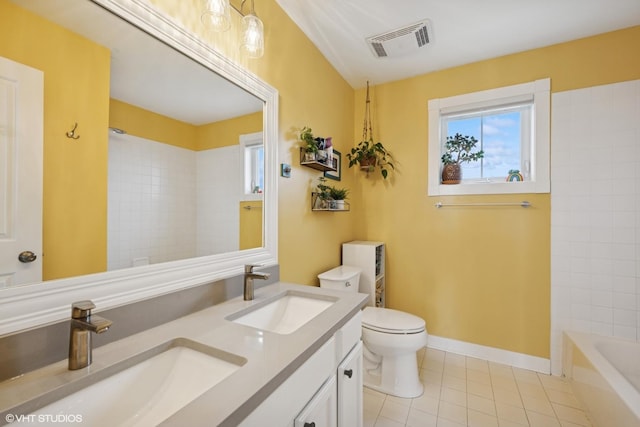 bathroom with toilet, tile patterned flooring, a sink, and visible vents