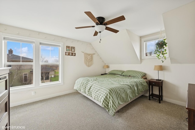 bedroom with ceiling fan, baseboards, and carpet