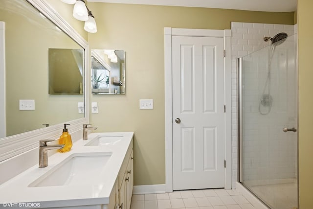 full bath with double vanity, tile patterned flooring, a stall shower, and a sink