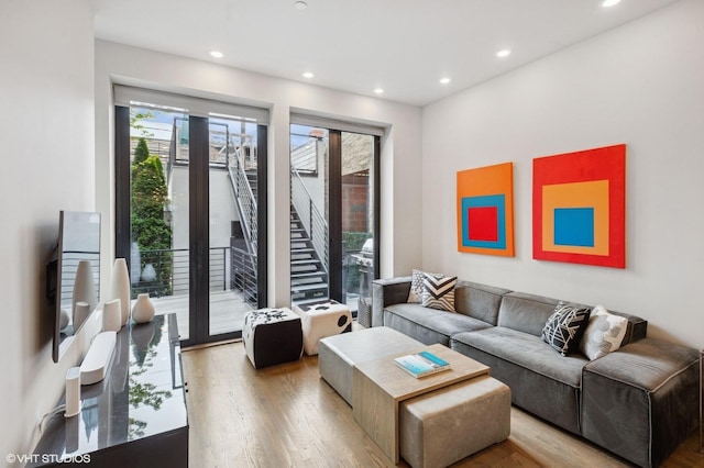 living room featuring light wood finished floors and recessed lighting
