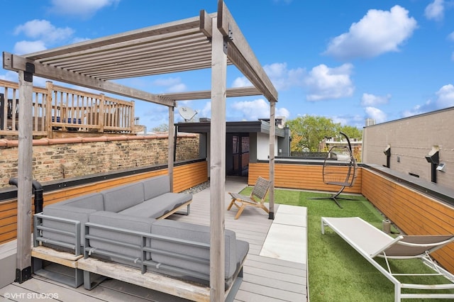wooden terrace with outdoor lounge area, fence, and a pergola