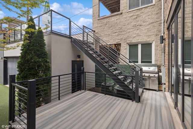 wooden deck with grilling area