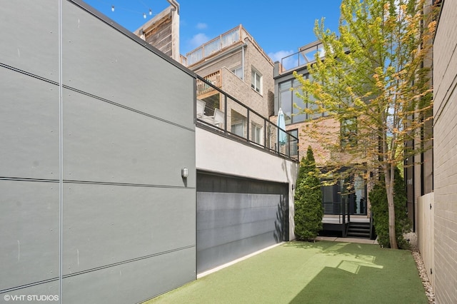 exterior space with stucco siding and a garage
