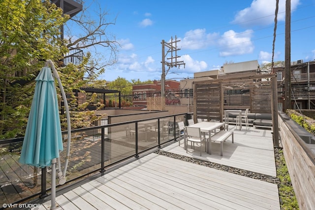 deck with outdoor dining area