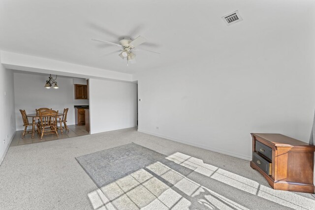 6135 W 94th St Unit C5, Oak Lawn, IL 60453 - carpeted living room with ceiling fan, baseboards, and a chandelier