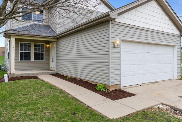 169 Waterbury Cir, Oswego, IL 60543 - view of front of home featuring concrete driveway and an attached garage