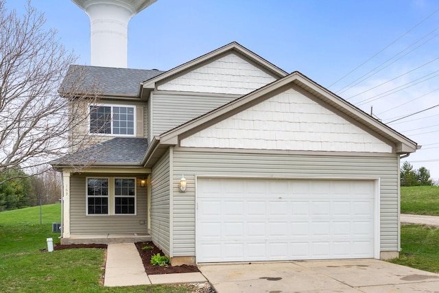 169 Waterbury Cir, Oswego, IL 60543 - traditional home featuring roof with shingles, a front lawn, a chimney, concrete driveway, and a garage