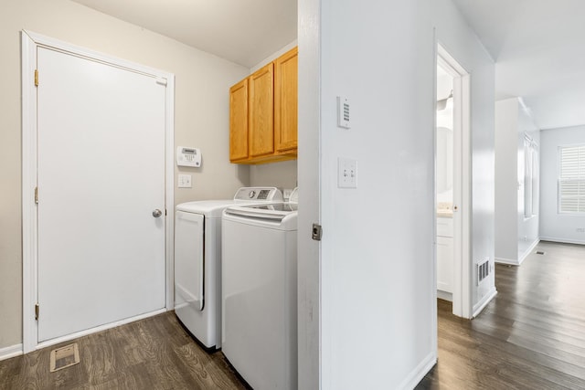 169 Waterbury Cir, Oswego, IL 60543 - clothes washing area with cabinet space, independent washer and dryer, visible vents, and dark wood-style floors