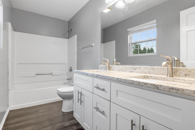 169 Waterbury Cir, Oswego, IL 60543 - full bath featuring toilet, wood finished floors, a sink, and double vanity