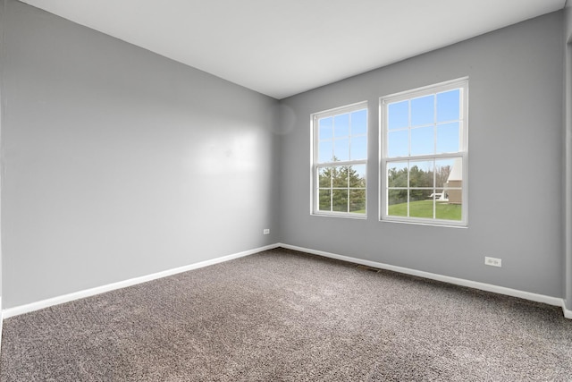 169 Waterbury Cir, Oswego, IL 60543 - carpeted spare room with visible vents and baseboards