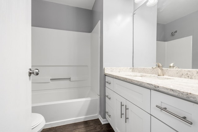 169 Waterbury Cir, Oswego, IL 60543 - bathroom with shower / bathing tub combination, wood finished floors, toilet, and vanity