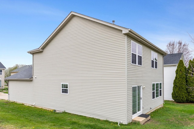 169 Waterbury Cir, Oswego, IL 60543 - view of side of home with a lawn