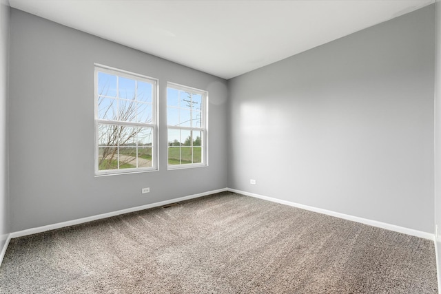 169 Waterbury Cir, Oswego, IL 60543 - unfurnished room featuring carpet floors, visible vents, and baseboards