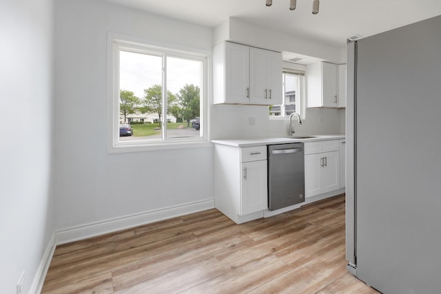 1062 Matfield Ct Unit 1062, Schaumburg, IL 60193 - kitchen featuring stainless steel appliances, light countertops, light wood finished floors, and healthy amount of natural light