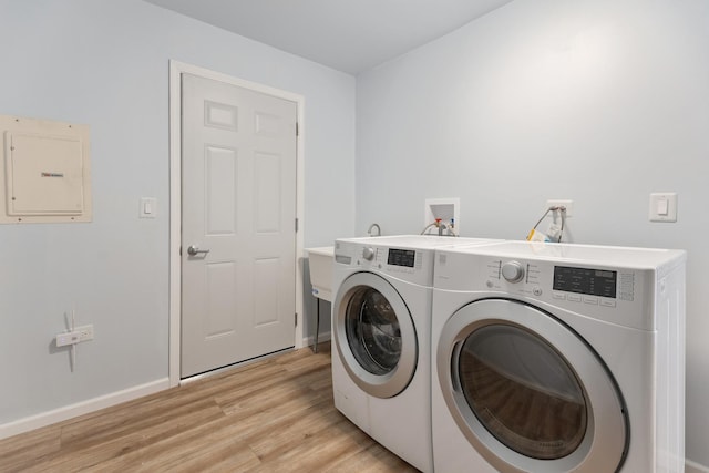 1062 Matfield Ct Unit 1062, Schaumburg, IL 60193 - washroom with independent washer and dryer, electric panel, light wood-type flooring, and baseboards