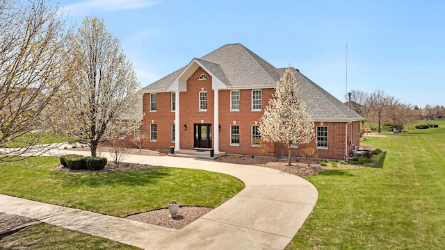 5255 Crescent Green Ct, Morris, IL 60450 - greek revival house featuring a shingled roof, brick siding, and a front yard
