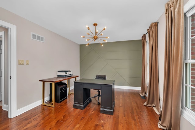 5255 Crescent Green Ct, Morris, IL 60450 - office space featuring visible vents, wood-type flooring, a decorative wall, baseboards, and a notable chandelier