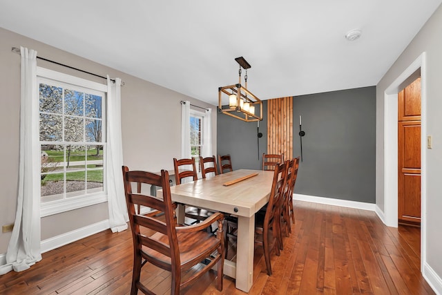 5255 Crescent Green Ct, Morris, IL 60450 - dining space with baseboards and dark wood-style flooring
