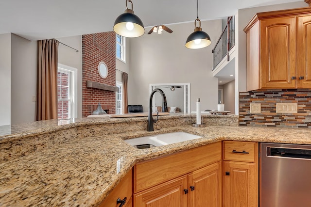 5255 Crescent Green Ct, Morris, IL 60450 - kitchen with a sink, backsplash, a high ceiling, light stone counters, and dishwasher