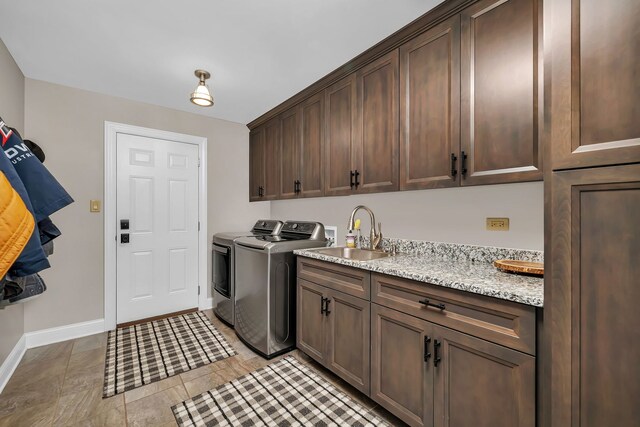 5255 Crescent Green Ct, Morris, IL 60450 - laundry area with washing machine and clothes dryer, a sink, baseboards, cabinet space, and light tile patterned floors