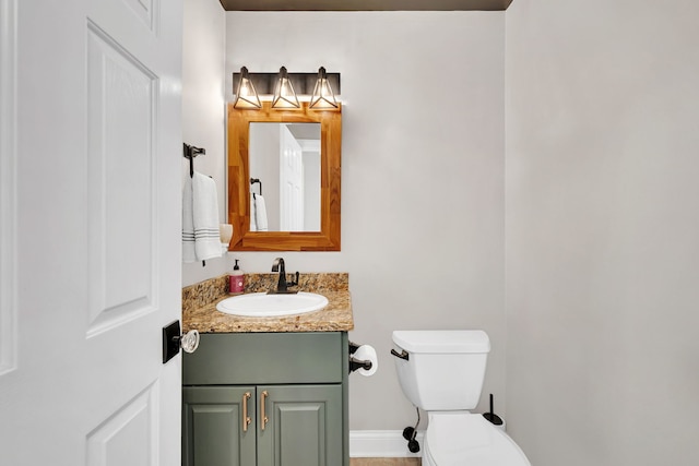 5255 Crescent Green Ct, Morris, IL 60450 - half bathroom featuring baseboards, toilet, and vanity