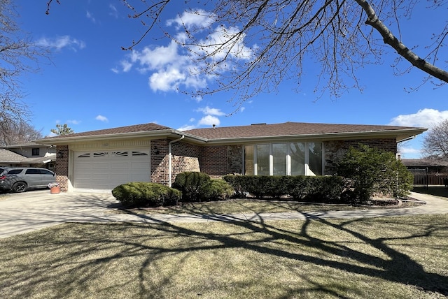 ranch-style home featuring a garage, a shingled roof, brick siding, and concrete driveway