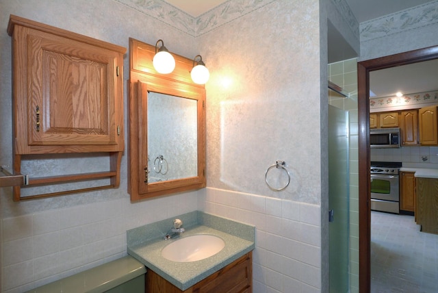bathroom with backsplash, toilet, and vanity