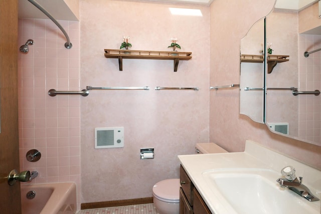 bathroom featuring toilet, vanity, and shower / bathing tub combination
