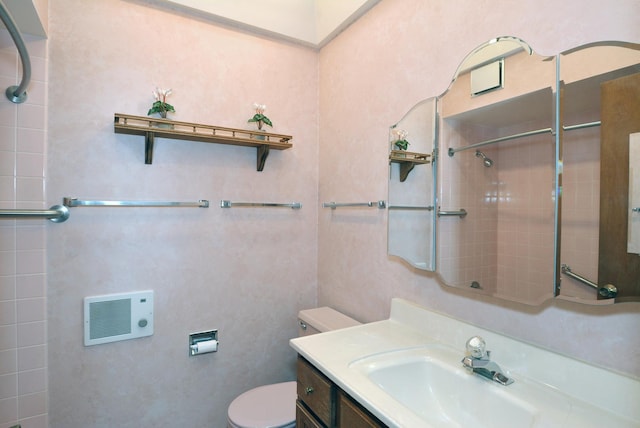 full bathroom with toilet, walk in shower, and vanity