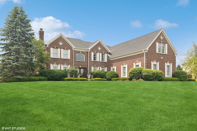 3 Turnbury Ct, Hawthorn Woods, IL 60047 - georgian-style home featuring brick siding, a chimney, and a front yard