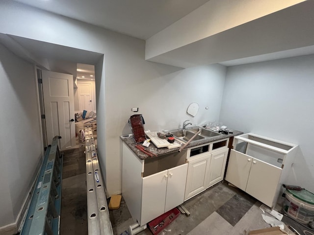 3039 W Flournoy St, Chicago, IL 60612 - kitchen featuring a sink and white cabinetry