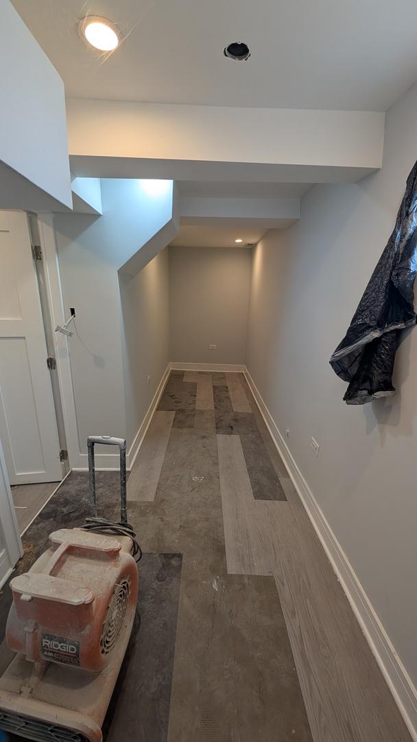 3039 W Flournoy St, Chicago, IL 60612 - corridor featuring wood finished floors and baseboards