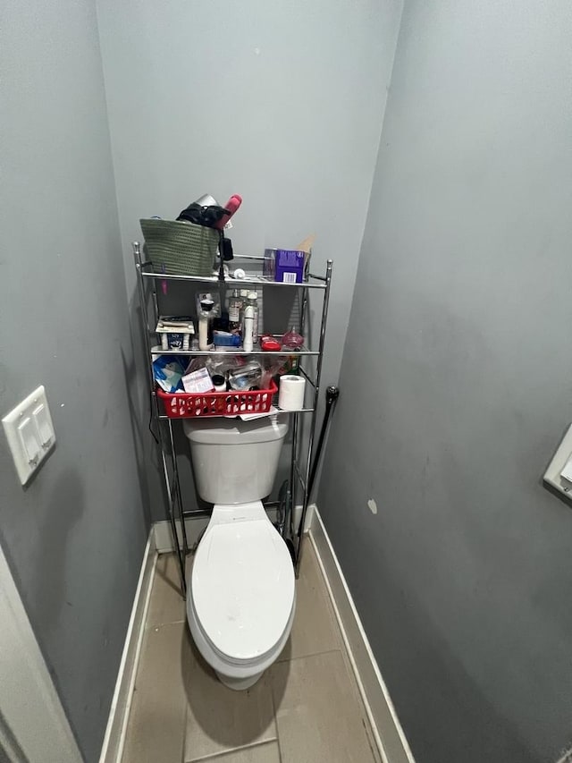 3039 W Flournoy St, Chicago, IL 60612 - bathroom featuring tile patterned floors, baseboards, and toilet