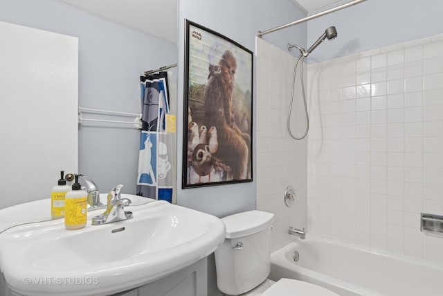 full bath featuring a sink, toilet, and shower / tub combination