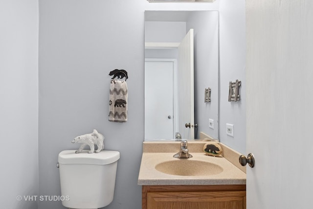 half bath with toilet and vanity