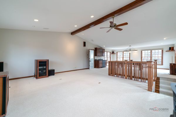 unfurnished living room with lofted ceiling with beams, a ceiling fan, recessed lighting, and light colored carpet