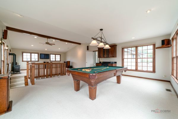 game room with light carpet, a wood stove, pool table, and recessed lighting